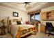 Warm bedroom featuring a nature-inspired aesthetic, mountain views, and built-in desk at 5526 E Roadrunner Rd, Paradise Valley, AZ 85253