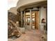 Grand entrance with a custom wood door and a tranquil water feature at 5526 E Roadrunner Rd, Paradise Valley, AZ 85253