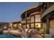 Stunning exterior with a pool, patio, and mountain views at 5526 E Roadrunner Rd, Paradise Valley, AZ 85253
