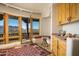 Breakfast nook with mountain view, wooden cabinetry, and plenty of natural light at 5526 E Roadrunner Rd, Paradise Valley, AZ 85253