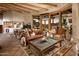 Open living room showcasing a cozy fireplace and expansive windows at 5526 E Roadrunner Rd, Paradise Valley, AZ 85253