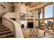 Inviting living room with a curved staircase and built-in shelving at 5526 E Roadrunner Rd, Paradise Valley, AZ 85253