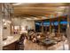 Spacious living room with wood beams, stone fireplace, and stunning views at 5526 E Roadrunner Rd, Paradise Valley, AZ 85253