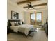 Comfortable main bedroom with exposed beams and private balcony with views at 5526 E Roadrunner Rd, Paradise Valley, AZ 85253