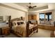 Comfortable main bedroom with unique wood accents, scenic views, and a cozy window seat at 5526 E Roadrunner Rd, Paradise Valley, AZ 85253