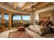 Serene main bedroom with mountain views and unique wooden headboard at 5526 E Roadrunner Rd, Paradise Valley, AZ 85253