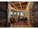 Rustic office with wood floors, large windows, and custom wooden doors at 5526 E Roadrunner Rd, Paradise Valley, AZ 85253
