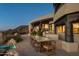 Covered outdoor dining space with desert landscaping and sunset views at 5526 E Roadrunner Rd, Paradise Valley, AZ 85253