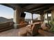 Inviting outdoor patio boasts a fireplace, comfortable seating, and breathtaking mountain views at 5526 E Roadrunner Rd, Paradise Valley, AZ 85253