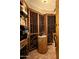 Charming wine cellar featuring custom wood racks, rustic accents, and ample storage space at 5526 E Roadrunner Rd, Paradise Valley, AZ 85253
