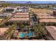 Aerial image showing a community with residential buildings, pool, and mountain backdrop at 5550 N 16Th St # 102, Phoenix, AZ 85016