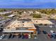 Aerial view of a shopping center with various stores and parking spaces at 5550 N 16Th St # 102, Phoenix, AZ 85016