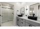 Modern bathroom with double vanity, shower, and black accents at 5550 N 16Th St # 102, Phoenix, AZ 85016