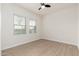 Bright bedroom with two windows and ceiling fan at 5550 N 16Th St # 102, Phoenix, AZ 85016