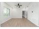 Bright bedroom with window, ceiling fan and wood-look flooring at 5550 N 16Th St # 102, Phoenix, AZ 85016