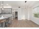 Bright dining room with hardwood floors and large window at 5550 N 16Th St # 102, Phoenix, AZ 85016