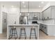 Modern kitchen with gray cabinets and a large marble island at 5550 N 16Th St # 102, Phoenix, AZ 85016