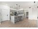 Modern kitchen with gray cabinets, marble island, and stainless steel appliances at 5550 N 16Th St # 102, Phoenix, AZ 85016