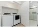 Laundry room with washer, dryer, and additional storage at 5550 N 16Th St # 102, Phoenix, AZ 85016