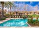 Community pool with lounge chairs and landscaping at 5550 N 16Th St # 102, Phoenix, AZ 85016