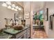 Bathroom with a unique stone sink and a walk-in shower at 9950 E Sundance Trl, Scottsdale, AZ 85262