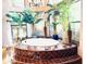 Oval bathtub with a tile surround and large windows at 9950 E Sundance Trl, Scottsdale, AZ 85262