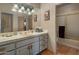 Bathroom with updated vanity, tile flooring, and shower at 9950 E Sundance Trl, Scottsdale, AZ 85262