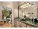 Spa-like bathroom with a large soaking tub and stone finishes at 9950 E Sundance Trl, Scottsdale, AZ 85262