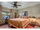 Spacious bedroom with built-in shelves and a wooden bed frame at 9950 E Sundance Trl, Scottsdale, AZ 85262