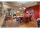 Elegant dining room with a rustic wood table and chandelier at 9950 E Sundance Trl, Scottsdale, AZ 85262