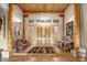 Grand entry with high ceilings, wood beams, and tile floors at 9950 E Sundance Trl, Scottsdale, AZ 85262