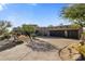 Three-car garage and desert landscaping highlight this one-story home at 9950 E Sundance Trl, Scottsdale, AZ 85262