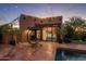 Casita with patio, pool, string lights, and relaxing seating area at 9950 E Sundance Trl, Scottsdale, AZ 85262