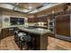Gourmet kitchen boasts granite island and high-end appliances at 9950 E Sundance Trl, Scottsdale, AZ 85262