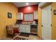 Charming kitchenette with white cabinets and modern appliances at 9950 E Sundance Trl, Scottsdale, AZ 85262