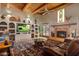 Relaxing living room with a fireplace and large windows at 9950 E Sundance Trl, Scottsdale, AZ 85262