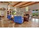 Spacious living room with a fireplace and built-in shelving at 9950 E Sundance Trl, Scottsdale, AZ 85262