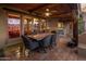 Outdoor patio with seating area and built-in kitchen at 9950 E Sundance Trl, Scottsdale, AZ 85262