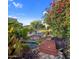 Inviting pool area with a wooden bridge and lush landscaping at 9950 E Sundance Trl, Scottsdale, AZ 85262