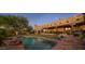 Stunning pool area with brick patio and landscape lighting at 9950 E Sundance Trl, Scottsdale, AZ 85262