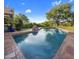 Stunning pool with a rock waterfall feature at 9950 E Sundance Trl, Scottsdale, AZ 85262