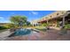 Relaxing pool area with tiled deck and lush landscaping at 9950 E Sundance Trl, Scottsdale, AZ 85262