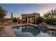 Stunning pool and patio area with outdoor kitchen and spa, perfect for entertaining at 9950 E Sundance Trl, Scottsdale, AZ 85262