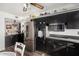 Kitchen with stainless steel appliances and dark wood cabinets at 10254 W Snead S Cir, Sun City, AZ 85351