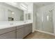 Modern bathroom with double vanity and large shower at 10838 W Buchanan St, Avondale, AZ 85323