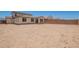 View of spacious backyard and exterior of the home from a distance at 12362 W Marguerite Ave, Avondale, AZ 85323