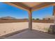 View of spacious backyard from covered patio area at 12362 W Marguerite Ave, Avondale, AZ 85323