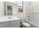 Bright bathroom with white subway tile surround and white cabinets at 12362 W Marguerite Ave, Avondale, AZ 85323
