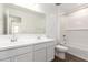 Bright bathroom featuring a double vanity, modern fixtures, and wood-look tile floor at 12362 W Marguerite Ave, Avondale, AZ 85323