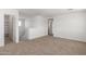 Bright bedroom with neutral carpet and a large entryway at 12362 W Marguerite Ave, Avondale, AZ 85323